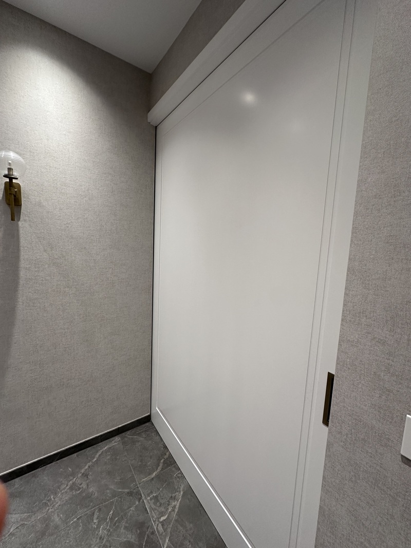 Professional MDF cabinet doors windows frames skirting boards spray painting for bespoke joinery and wardrobes in NW London by Kadeco Interiors.