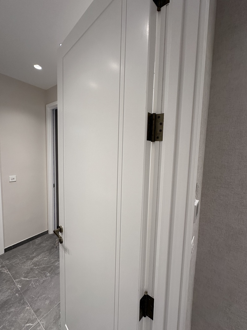Professional MDF cabinet doors windows frames skirting boards spray painting for bespoke joinery and wardrobes in NW London by Kadeco Interiors.